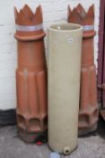 A pair of chimney pots as planters, and a tall ceramic cylindrical stand Best Bid