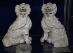 A pair of 19th Century Staffordshire spaniel models; 33cm high