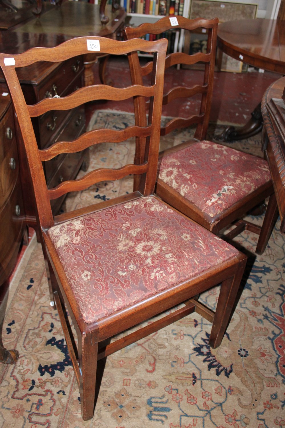 A set of six 19th Century mahogany ladder back dining chairs each with drop in seat