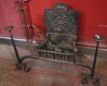 A Victorian firebasket on legs, with a cast iron fireback attached, plus two utensil stands, a pair