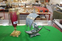 A Claret ground gilt metal mounted urn in the Sevres style with twin lion mask handles, together