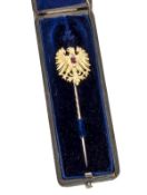 A Fine and Intriguing Gold German Imperial Stick-Pin, set with inlaid garnet and diamonds,