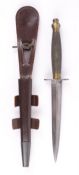 An F&S Fighting Knife, 2nd Pattern with brass chequered grip, in its leather sheath