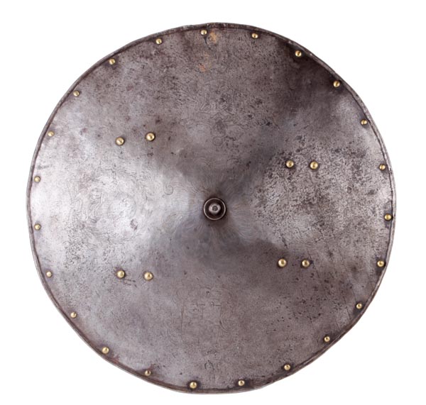 An Italian Circular Shield, 16th Century, of convex circular form, raising at its centre to a