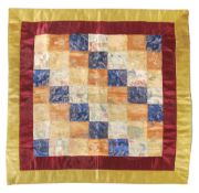A Tibetan silk geometric ritual cloth, 19th century, of squarish shape  A Tibetan silk geometric