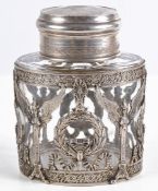 A German silver coloured mounted oval cut glass jar and cover by Weinranck &... A German silver
