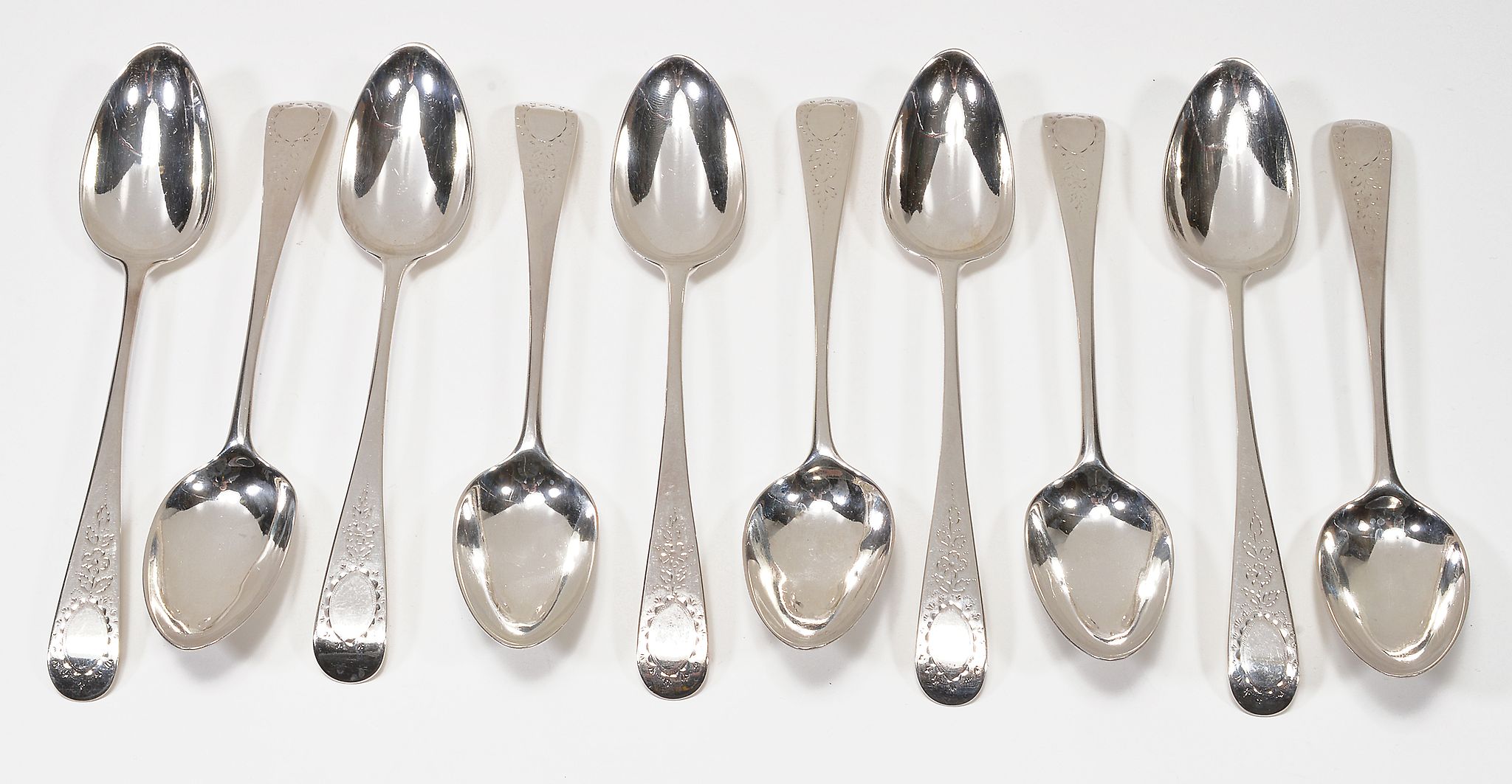 A set of ten George III silver Old English pattern dessert spoons by Thomas... A set of ten George