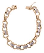 A gold coloured diamond bracelet, composed of alternating polished circular... A gold coloured
