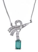 An emerald and diamond necklace, the rectangular step cut emerald suspended... An emerald and