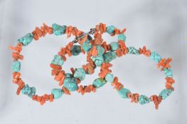 A coral and turquoise necklace, the double strand necklace with alternating... A coral and