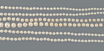 Three cultured pearl necklaces, the three necklaces with graduated cultured... Three cultured pearl