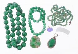 A jadeite bead necklace, the uniform beads with mottled white and green colour A jadeite bead