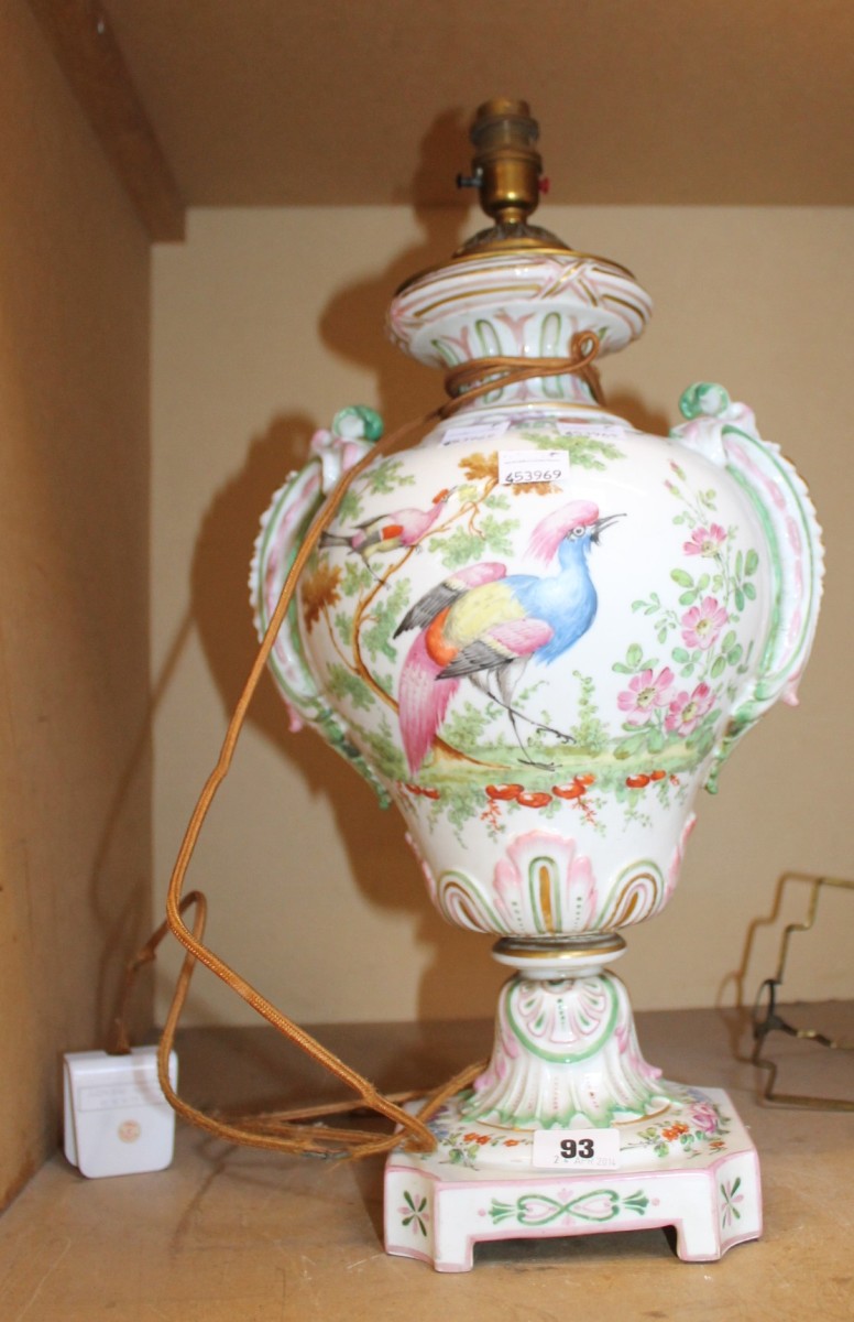 A porcelain table lamp, decorated with exotic birds, gold anchor mark to base; approximately 42cm