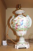 A porcelain table lamp, decorated with exotic birds, gold anchor mark to base; approximately 42cm