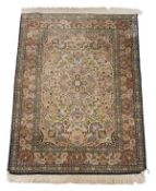 A Kashan style rug, the cream field and pink borders decorated with foliage and boteh throughout,