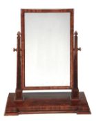A William IV figured mahogany dressing mirror, circa 1835, the rectangular plate within square