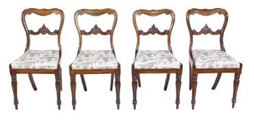 A set of four William IV rosewood dining chairs, circa 1835, each moulded cartouche-shaped back