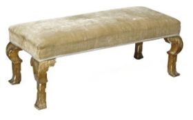 An Edwardian carved and giltwood and velvet upholstered long stool in George I style, early 20th