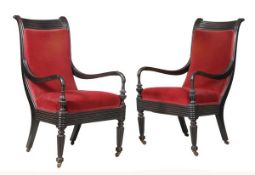 A pair of Ceylonese ebony framed and upholstered armchairs, circa 1850, each shaped rectangular