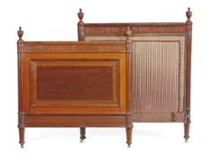 A mahogany single bed, in George III style, 20th century, the head and footboard with carved urn
