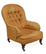 A Victorian walnut and button upholstered armchair, in the manner of Howard & Sons, the hooped
