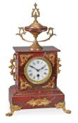A French rouge marble and gilt-metal-mounted mantel timepiece, with single train movement, late