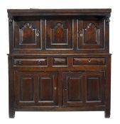 An oak court cupboard, dated 1755, the upper section with three arched moulded panels