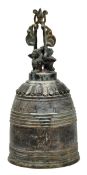 A Chinese bronze bell moulded with dragon faces, 35cm high, 20th century. Provenance: Private