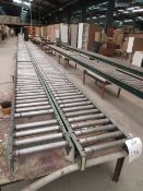 Approximately four runs of gravity roller conveyor lengths each up to approximately 30m long and