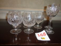 Five various crystal cut glass brandy glasses and two red wine glasses