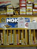 Quantity of NGK and Honda spark plugs, approximately 150