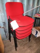 Nineteen cloth upholstered steel framed stacking side chairs, in dark red (Please note: This lot