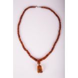 CHINESE AMBER BEADS NECKLACE AND PENDANT