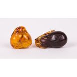 TWO CHINESE AMBER TOGGLES