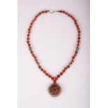 AN OLD AGATE NECKLACE WITH PENDANT