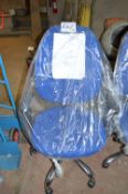 Blue upholstered swivel arm chair