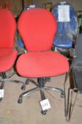 Red upholstered swivel chair