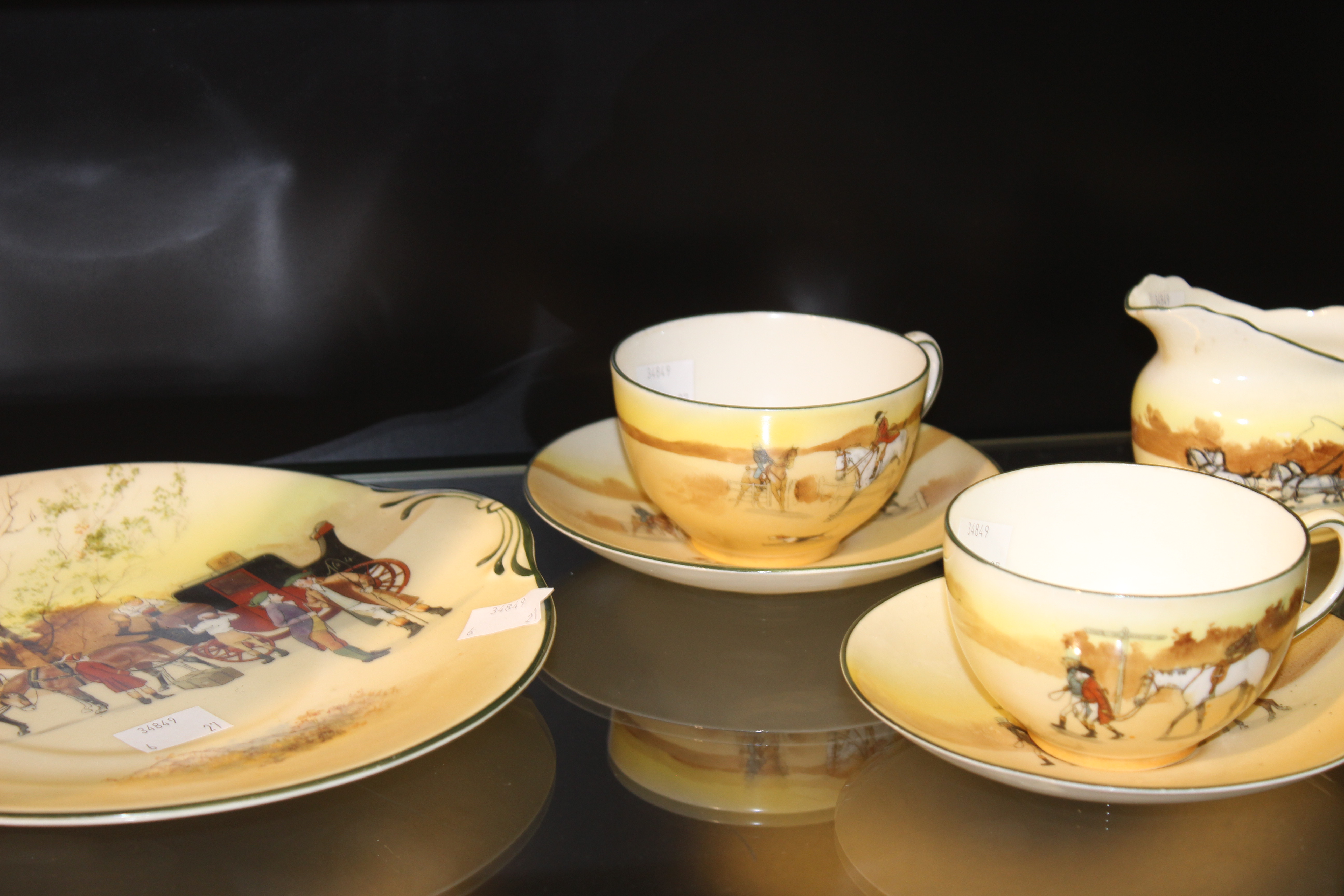 A Royal Doulton hunting scenes cups/saucers and plates, 12 pieces, a Royal Doulton coaching scenes