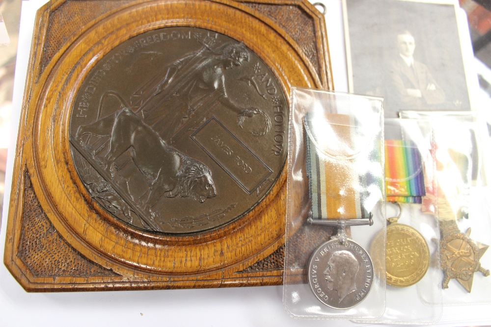 A WWI death plaque and medals for James Ford, 1462 Notts and Derbyshire Regiment including the