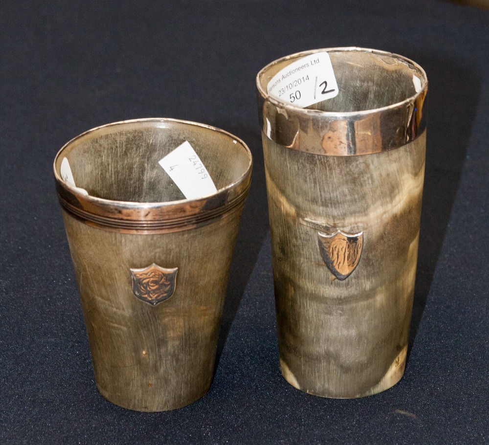 Two Victorian horn beakers, silver rims and cartouches