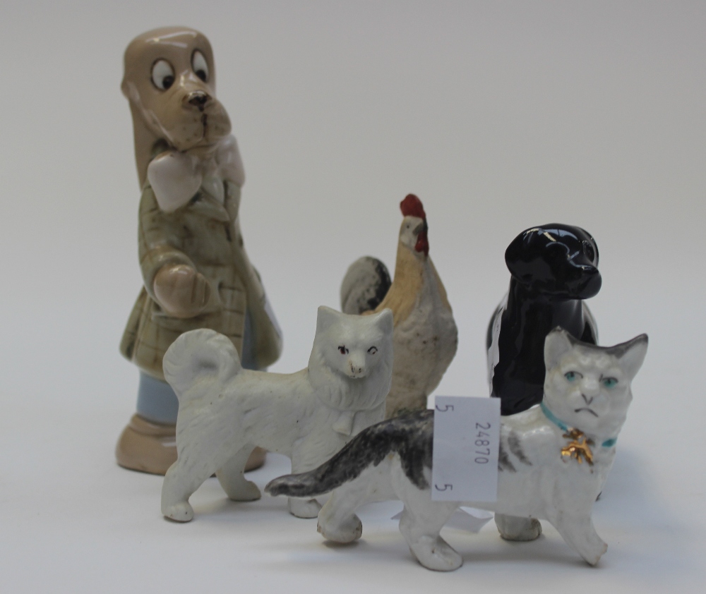 A Royal Dux figure of a cartoon Bloodhound; together with a Beswick Black Labrador and three 19th