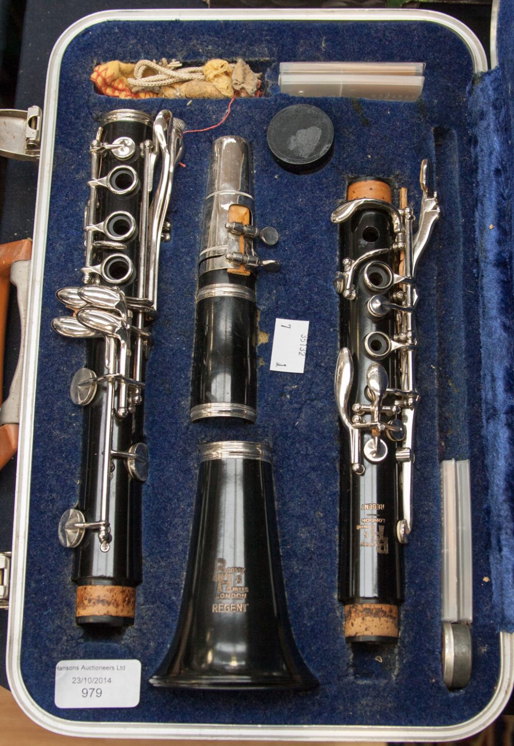 A cased Boosey and Hawkes Regent plastic clarinet, with some accessories
