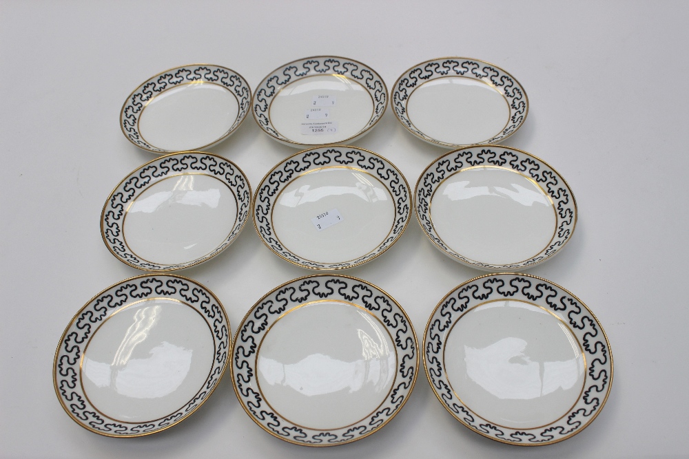 A set of nine Spode Pinxton replacement saucers, black wavy line between gilt borders, unmarked