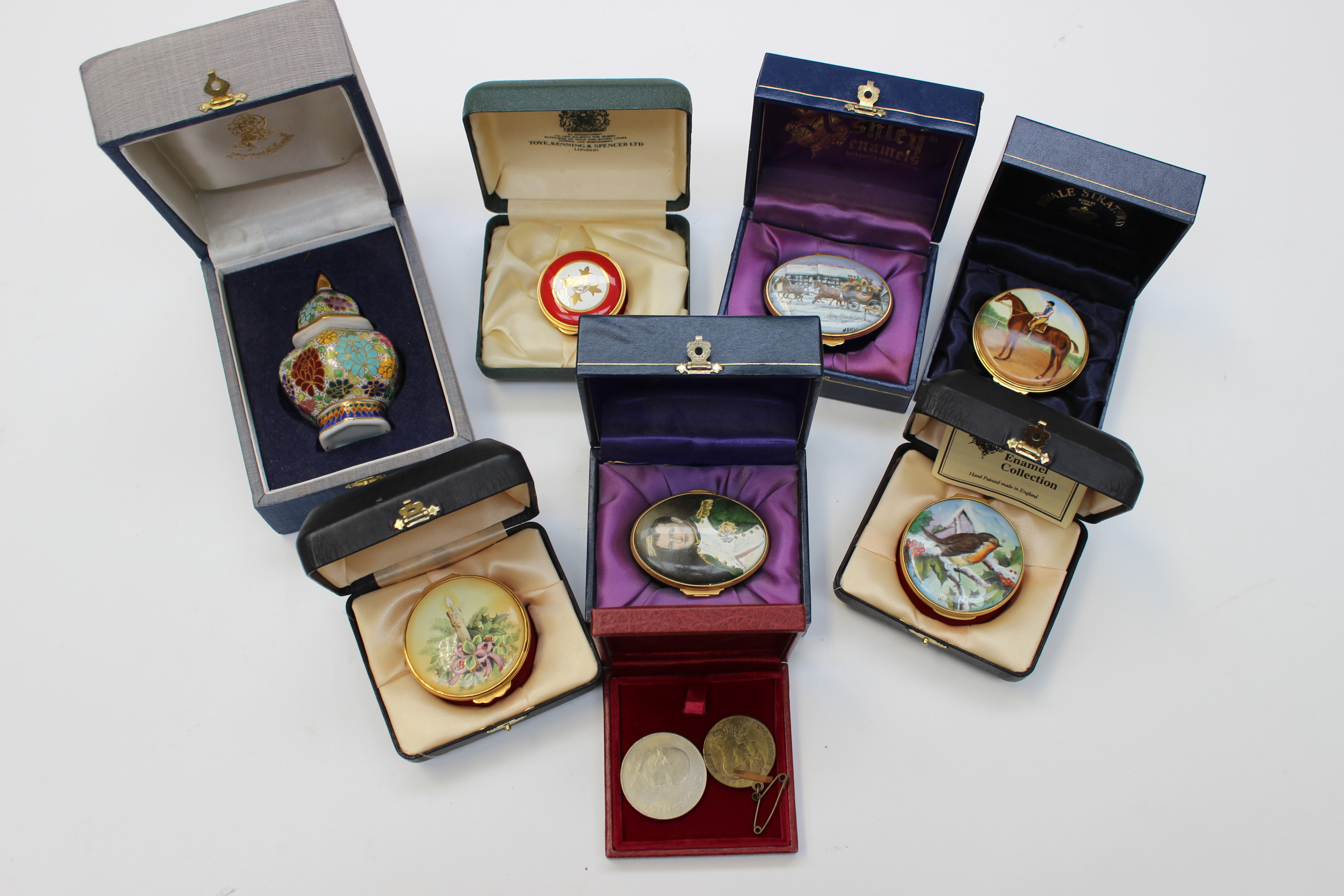 A collection of enamelled boxes by Ashley enamels, Royal Stratford and Toye, Kenning and Spencer