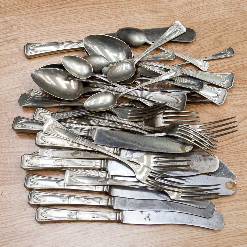 A quantity of late 19th /early 20th C German cutlery (ten knives) 5 serving spoons, 8 teaspoons,