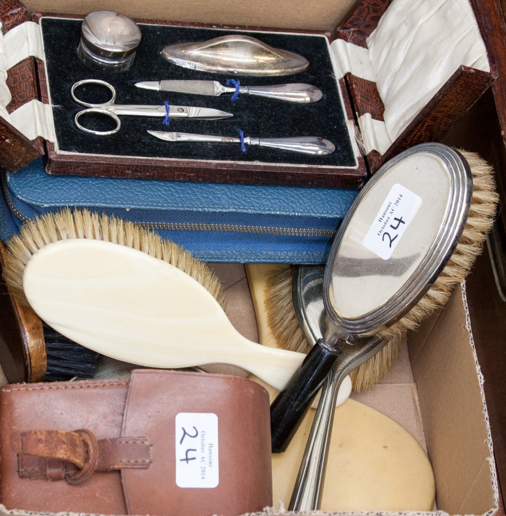 A cased silver mounted manicure set and a quantity of EPNS and other dressing brushes, etc