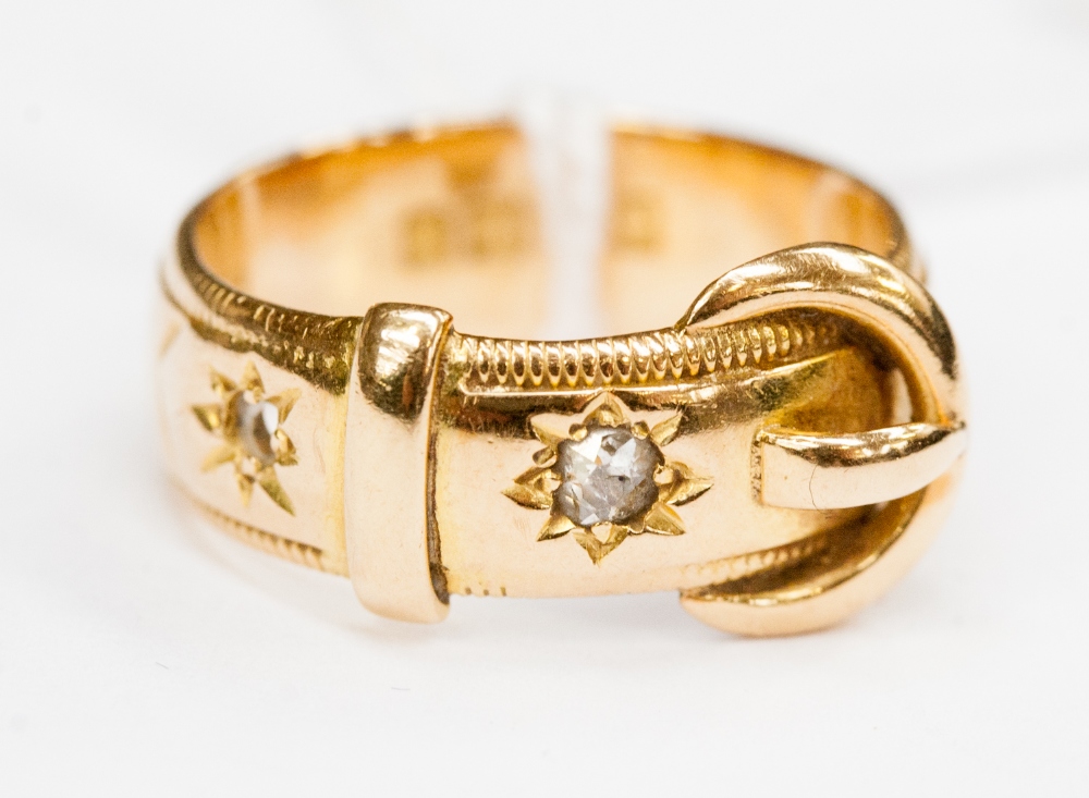 An 18ct gold and diamond ring in the form of a belt, gypsy set old cut diamond (one stone missing)