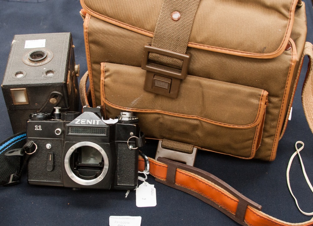 A Zenith 35 mm approx camera and two lenses (a 58 mm and 135 mm approx) and a Kodak Brownie