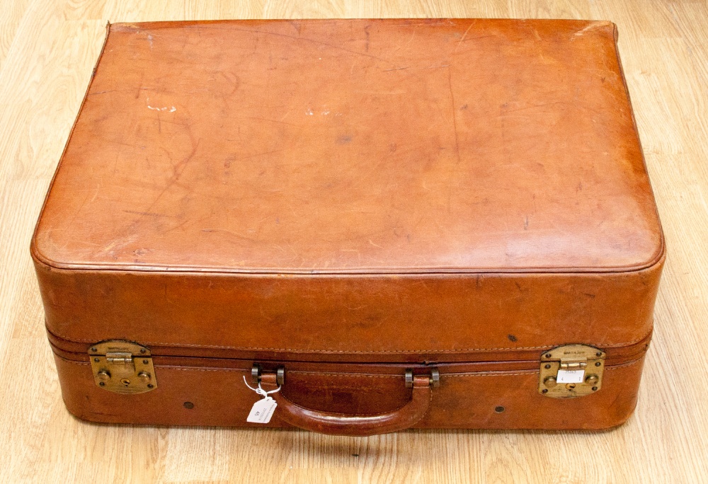 An early 20th century Watajoy leather suitcase, complete with original internal straps