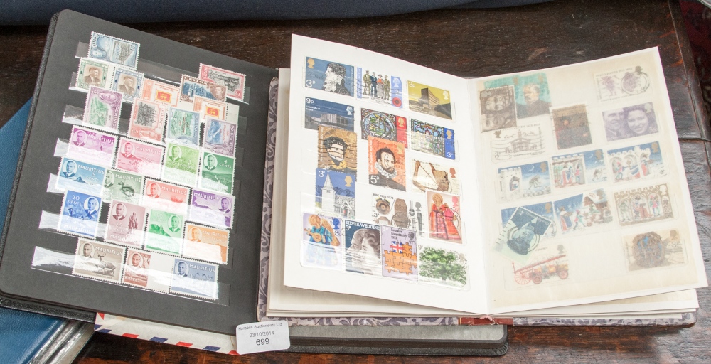 A stamp collection in three albums most value in small black stock book of mint KGV1 material
